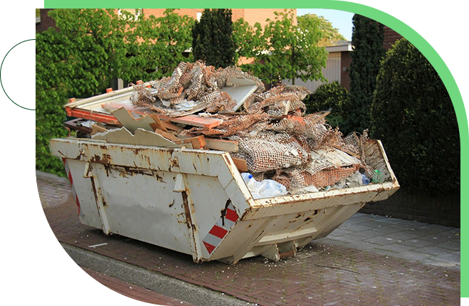 A dumpster full of rubble on the side of a road.